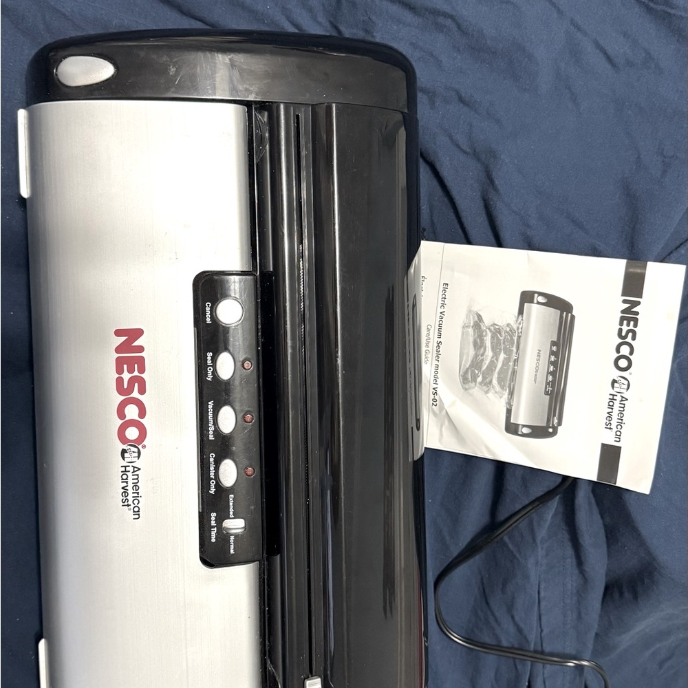 Nesco model VS02 electric vacuum sealer with more. See function pic attached.